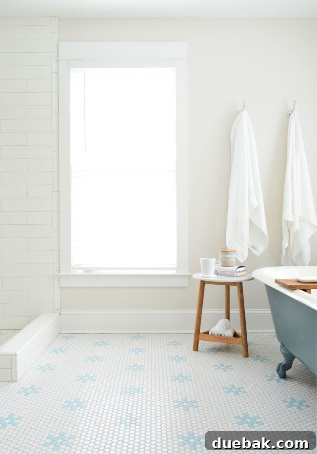 Our Beach House Makeover: Upstairs Edition 27 Rebuilt en-suite bathroom with reconfigured tub, freestanding shower, and custom hex floor tile