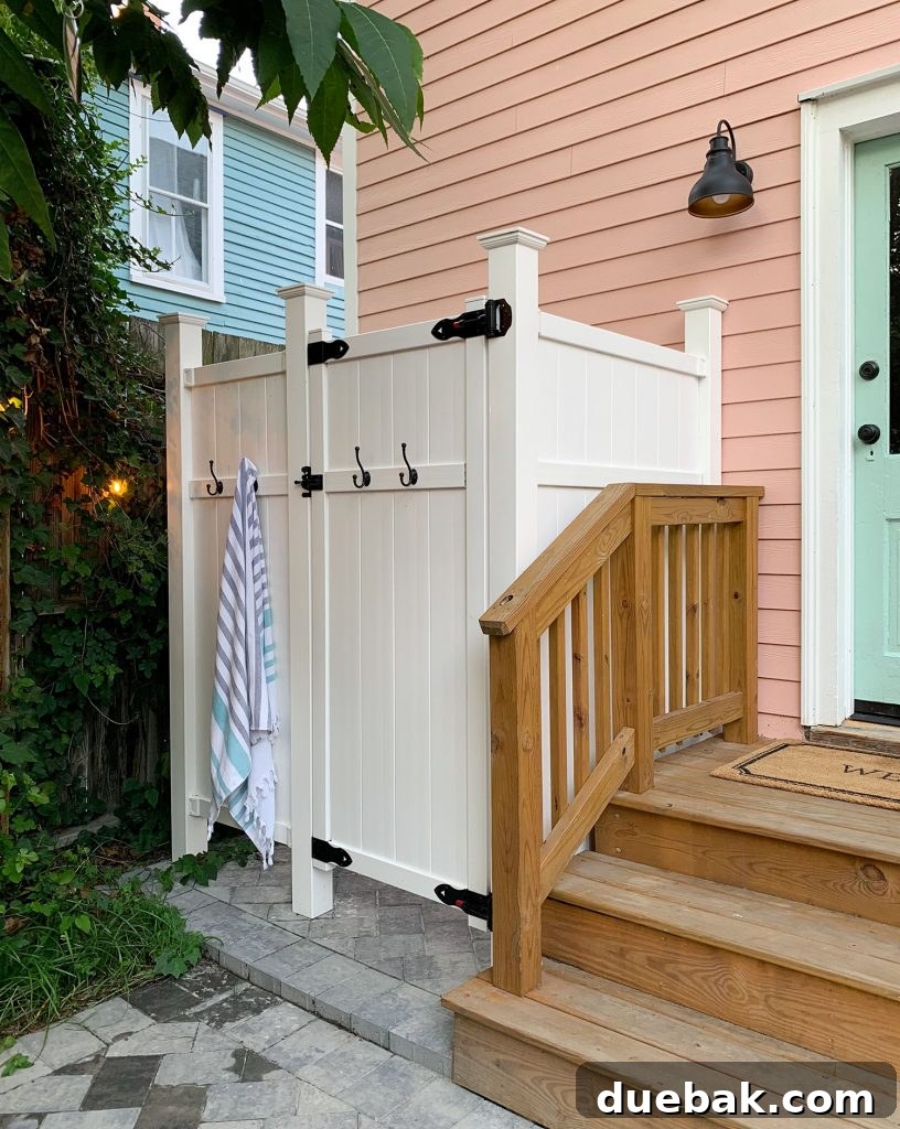Our Beach House Makeover: Upstairs Edition 36 Outdoor shower in beach house backyard, convenient for beach living