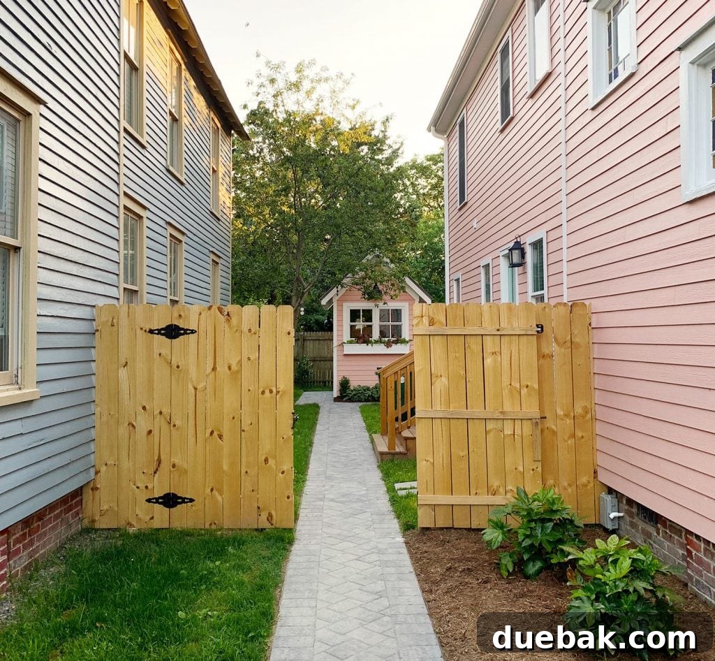 Our Beach House Makeover: Upstairs Edition 39 Transformed side yard with new matching fence, leading to shed and backyard