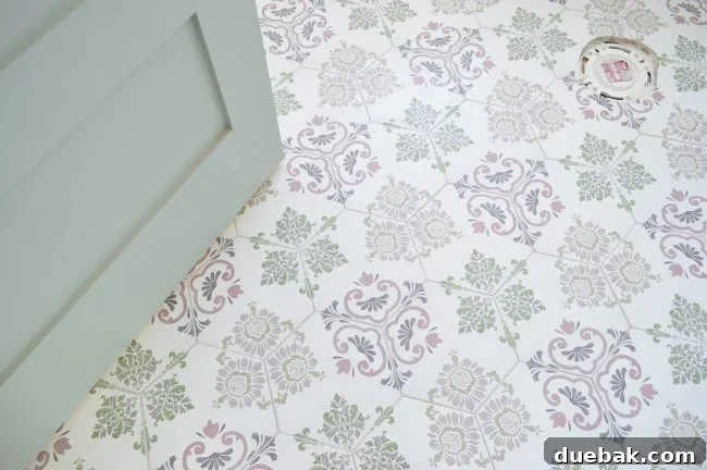 Hall bathroom featuring a complex patterned hex floor tile and an Oyster Bay door.