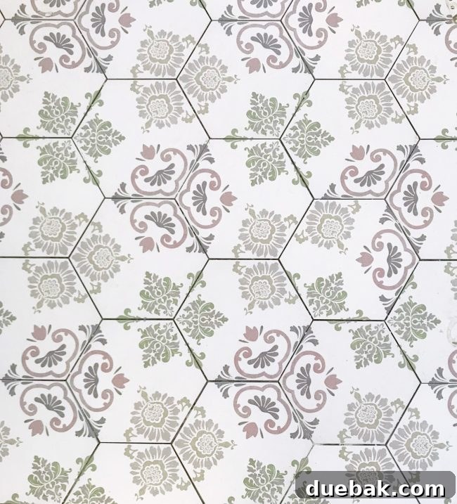 Close-up of a patterned hex tile floor, with one tile subtly misaligned, creating a visible flaw.
