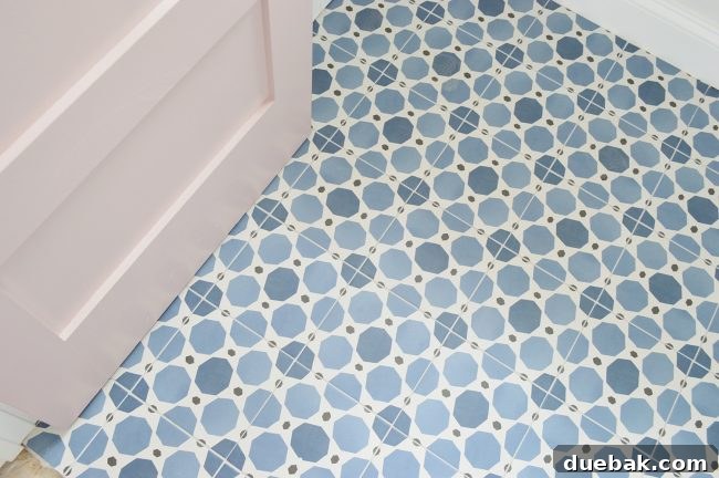 Bathroom floor featuring easy-to-install square patterned blue and white tiles.
