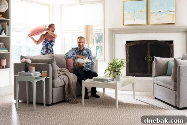 Valet End Table, Mellow Sofa, Stenciled Coffee Table, and Mellow Armchair in a modern living room setting
