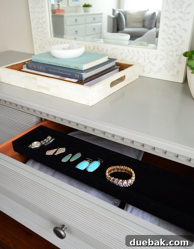 Debonair Dresser, highlighting its sophisticated design and a hidden sliding velvet jewelry tray
