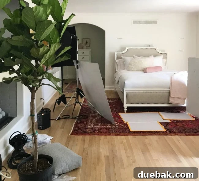 Behind-the-scenes shot of a furniture photoshoot, showcasing the setup for a styled living space