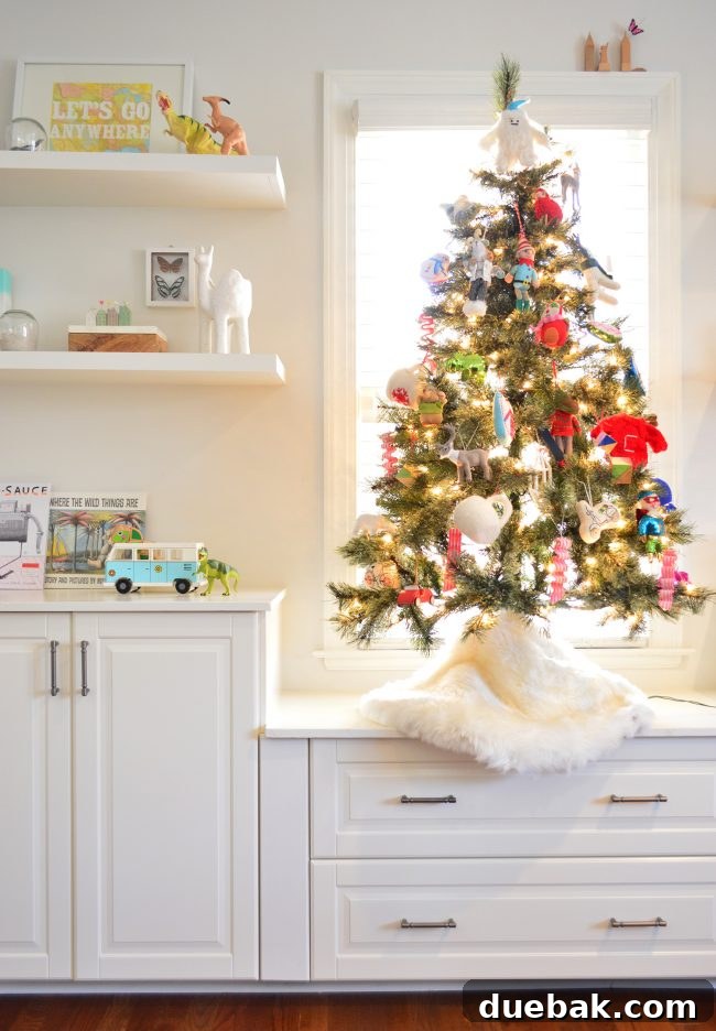 Double the Sparkle: Holiday Decorating at Home and the Beach 11 A small Christmas tree in a bonus room, decorated with soft, plush ornaments.