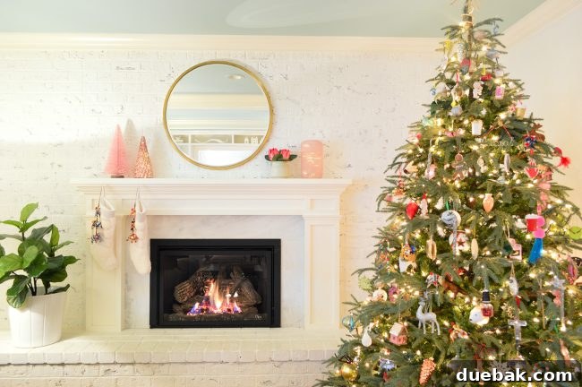 Double the Sparkle: Holiday Decorating at Home and the Beach 6 A simple Christmas mantel with a pink bottle brush tree and a pink mercury glass tree.