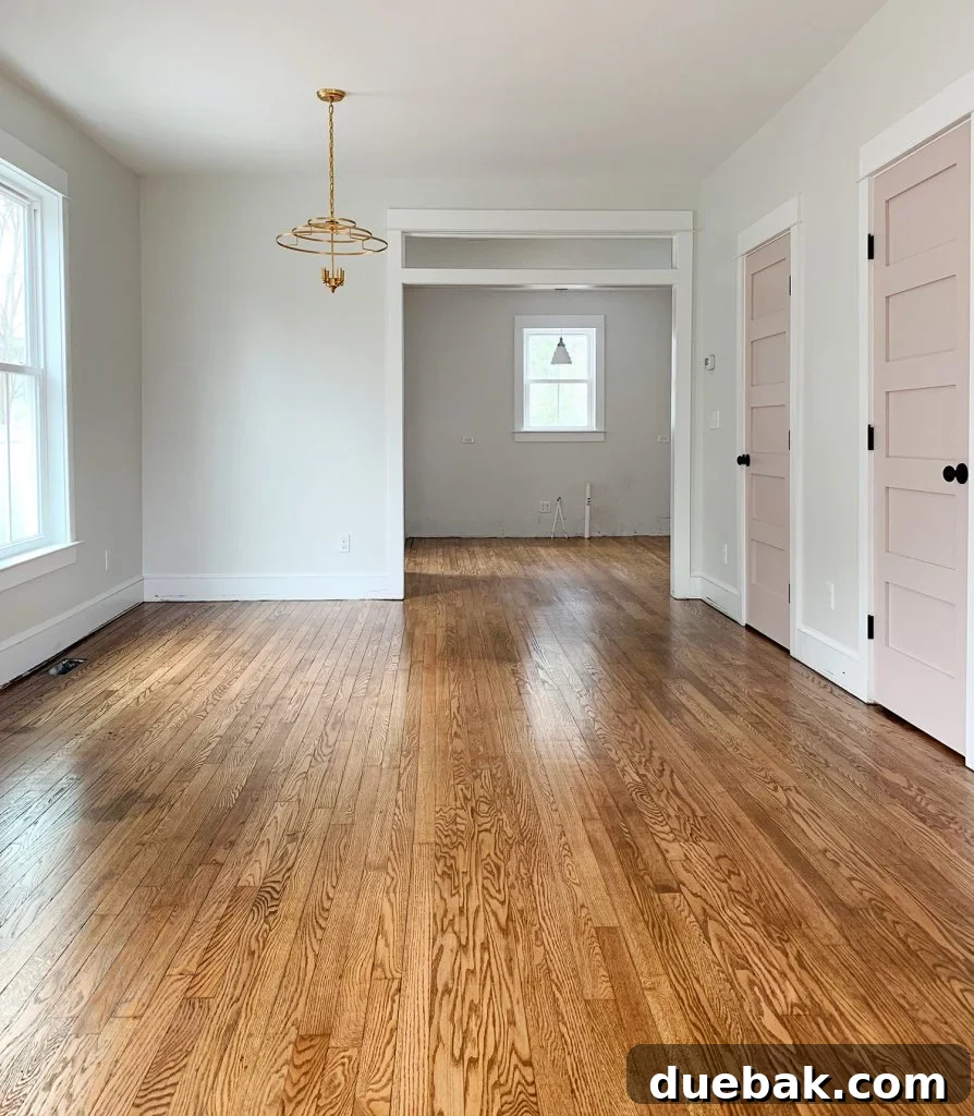 Reviving Oak and Pine Floors 2 Duplex living room after hardwood floor refinishing, showing gleaming, warm-toned oak floors and a refreshed space.