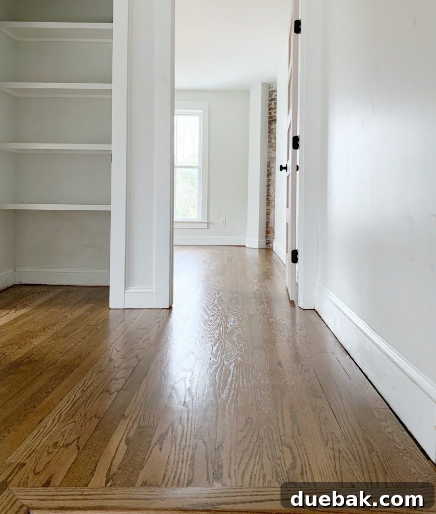 Reviving Oak and Pine Floors 13 The fully repaired and refinished floor, showcasing the perfect blend of old and new sections.