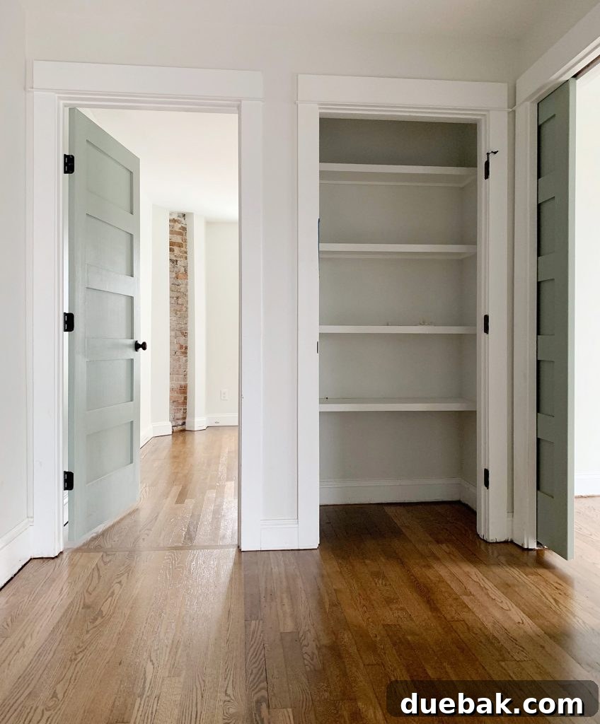 Reviving Oak and Pine Floors 16 The finished floor with 'Special Walnut' stain, showing a subtle transition between white oak in the hallway and red oak in the bedroom.