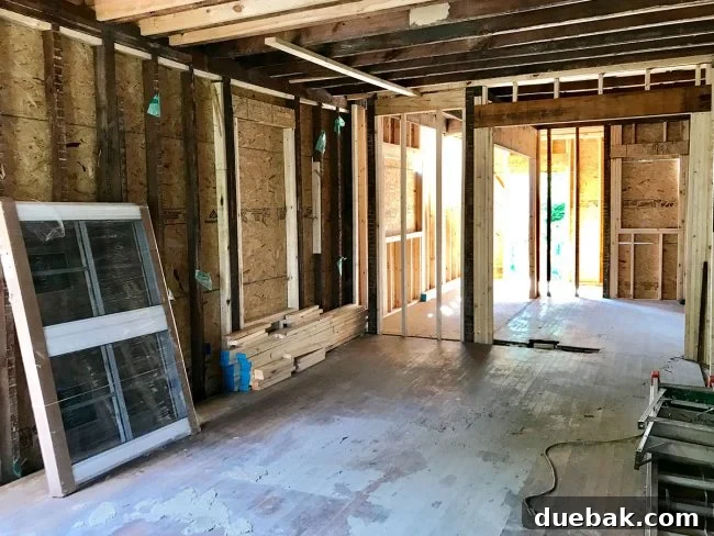 Reviving Oak and Pine Floors 4 Duplex living room during renovation, showcasing the accumulating dust and mess on the floors.