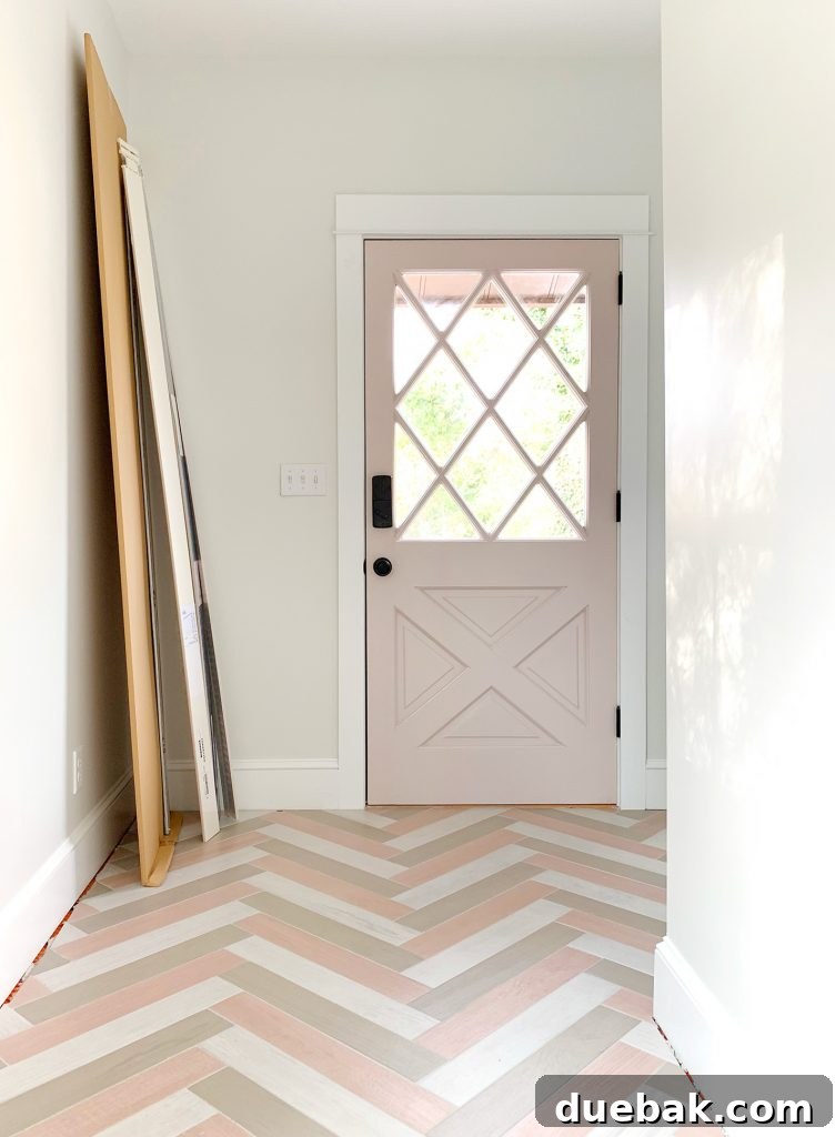 Left side duplex mudroom with unique tile colorway.