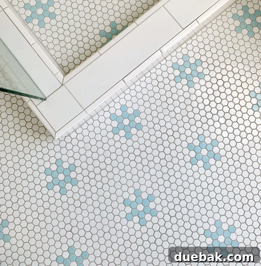 Finding Your Best Grout: Tips for Perfect Color Selection 6 Hex tile bathroom floor with aqua blue flower shapes