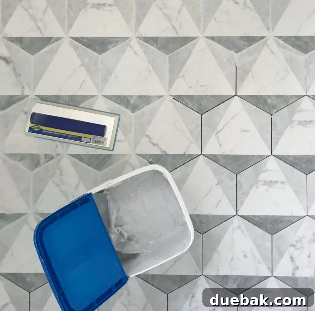 Finding Your Best Grout: Tips for Perfect Color Selection 8 marble hex tiles getting grouted with mapei grout