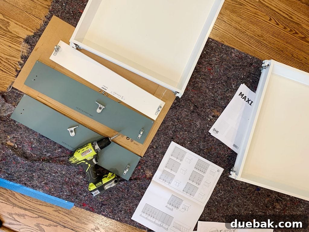 Close-up of IKEA drawers being assembled and adjusted.