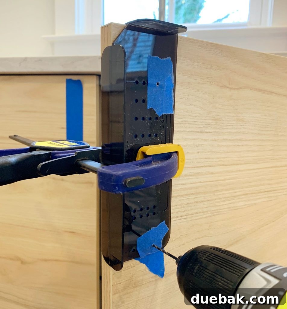 Using Template To Make Pilot Holes In Cabinet Door for a corner-mounted knob or pull.