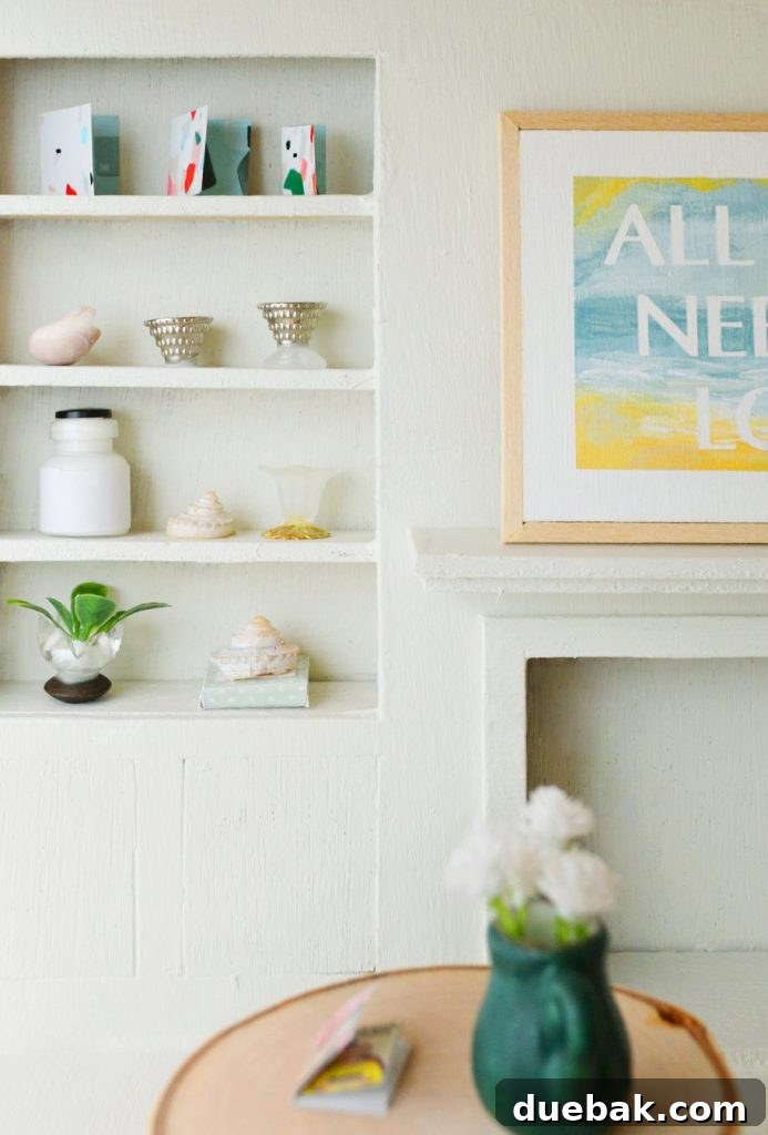 Close-up of the built-in shelves in the dollhouse living room, decorated with tiny treasures and DIY plants.