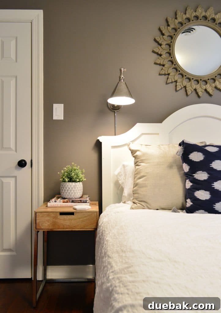 Faux ikea greenery on side table in guest room