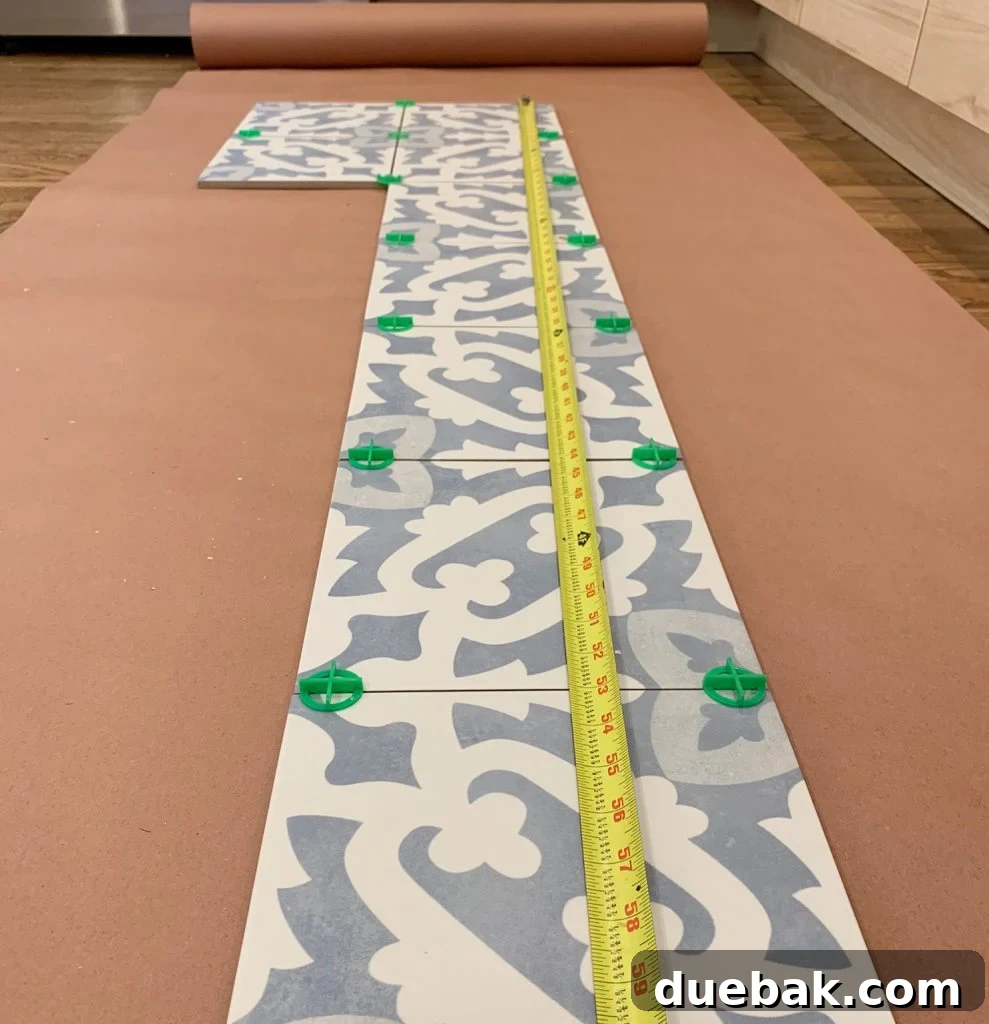 Measuring Tape on Patterned Backsplash Tile to Confirm Actual Tile Dimensions and Layout