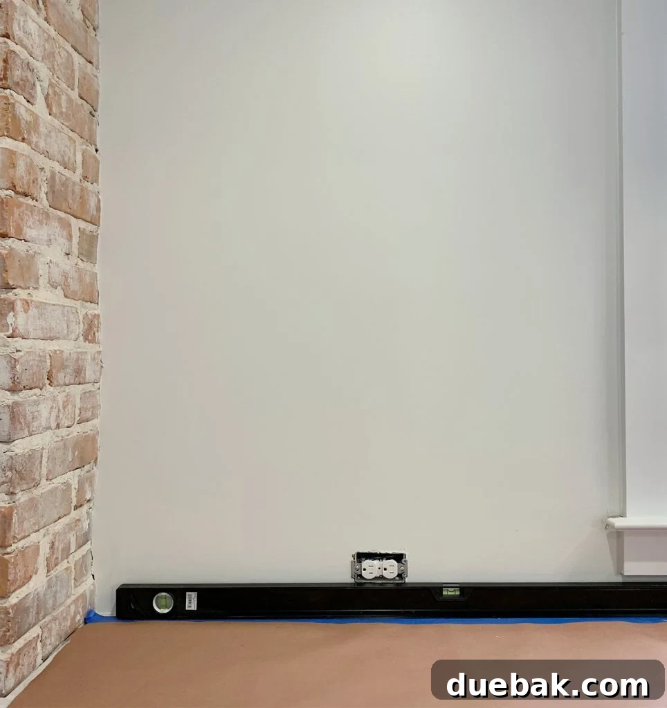 Using a Level Along Counter to Check Level Before Backsplash Installation Begins