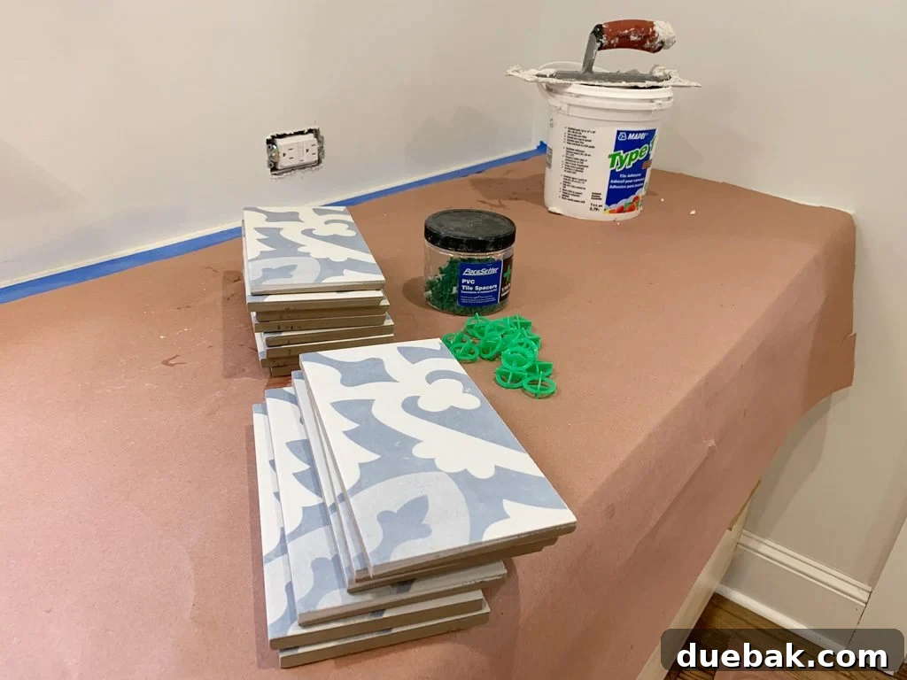 First Row of Tiles Pre-Cut and Ready Before Adhering to Backsplash Wall