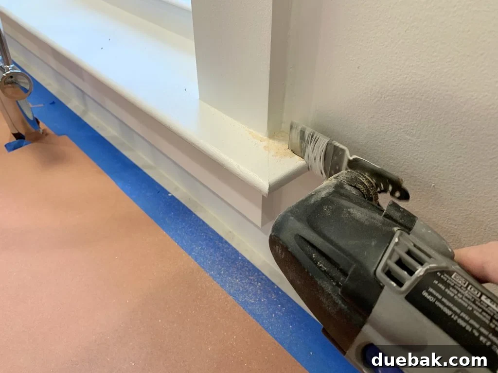 Trimming Window Molding with a Dremel Before Backsplash Tile Installation