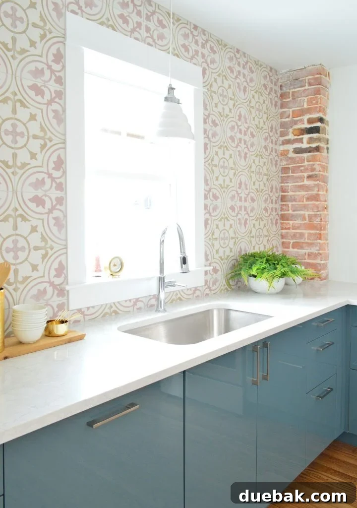 Pink Patterned Tile in Blue Kitchen with Exposed Brick Chimney Feature