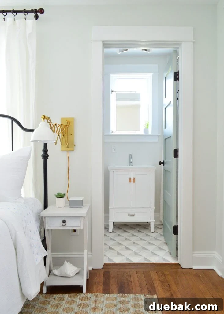 Our Airbnb Bedroom and Bathroom Makeover Full Reveal 7 The main bedroom showcasing custom built-in closets with original salvaged doors, adding historical charm and character.