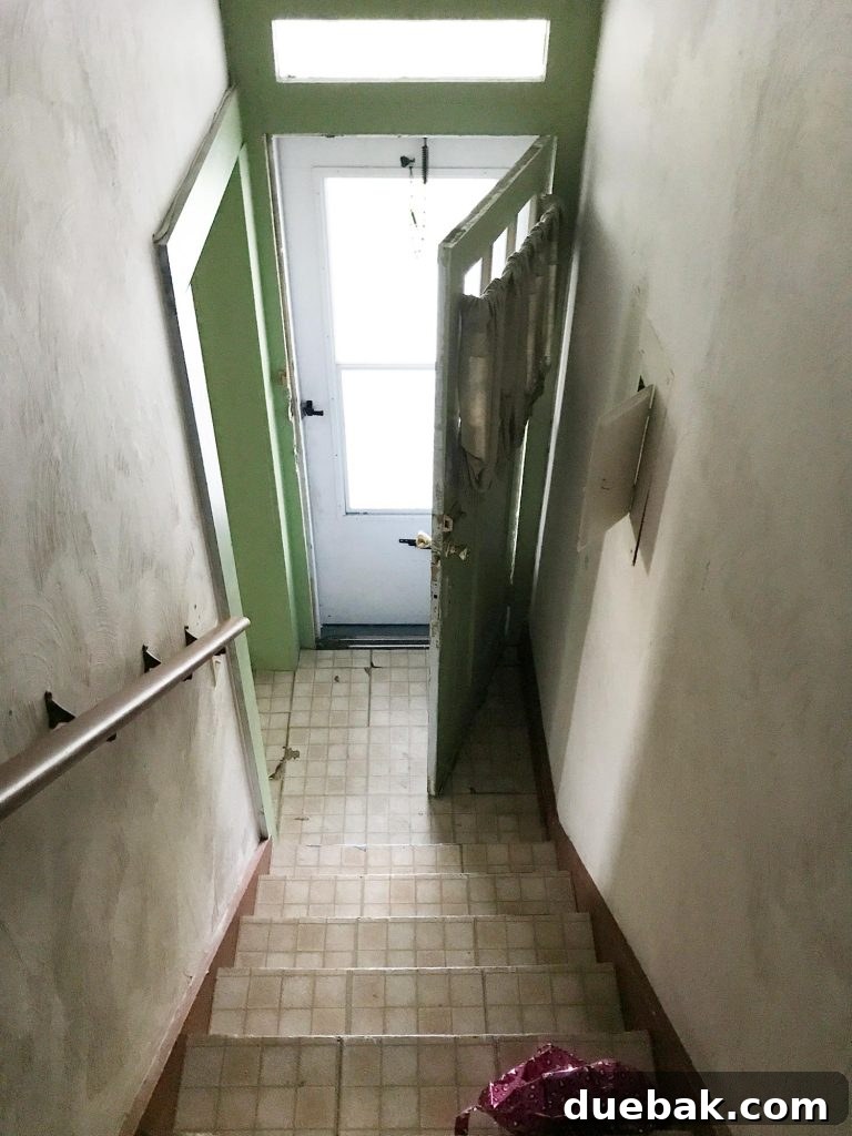 Elevating Our Airbnb Bedroom and Bathroom Updates 21 Duplex Entryway Before Renovation - Narrow and Dark