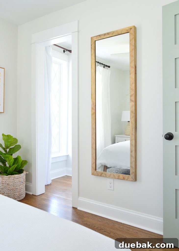 Elevating Our Airbnb Bedroom and Bathroom Updates 27 Duplex Right-Side Front Bedroom with Wood-Framed Mirror and Diamond Window Closet