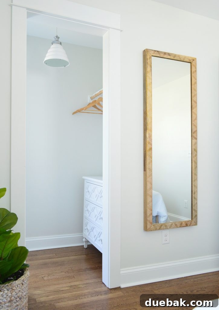 Elevating Our Airbnb Bedroom and Bathroom Updates 28 Duplex Right-Side Front Bedroom with Diamond-Fronted Dresser and Pendant Light