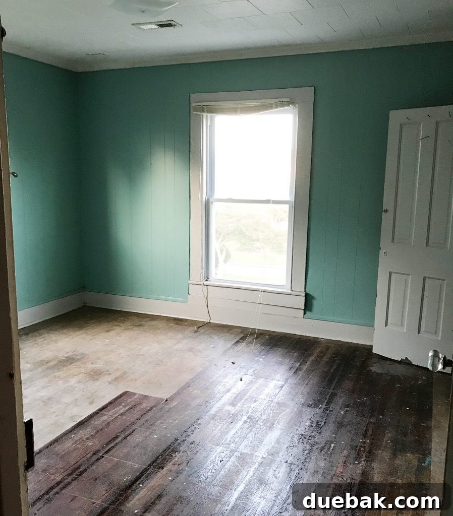 Elevating Our Airbnb Bedroom and Bathroom Updates 29 Duplex Right-Side Front Bedroom Before Renovation - Drop Ceilings and Bad Flooring