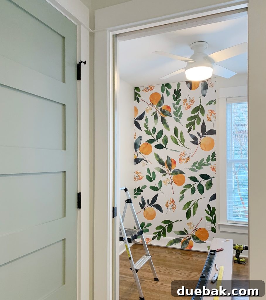 Elevating Our Airbnb Bedroom and Bathroom Updates 32 Removable Orange Blossom Wallpaper Installation With Blue Painted Door
