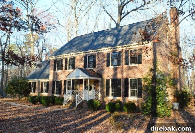 Before photo of brick house with dated brick upon purchase of home