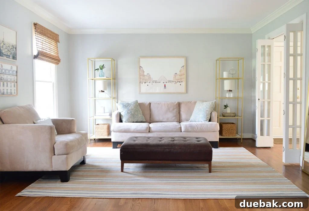 A beautifully staged living room area with neutral tones and minimalist decor, designed to appeal to potential buyers.