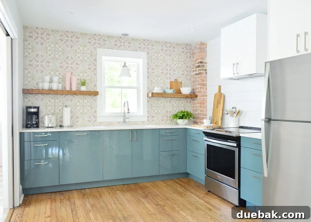 Dual Kitchen Transformations: Our Airbnb's Story 3 Full Duplex Kitchen with Planked Wall and Pink Patterned Tile Backsplash, featuring blue cabinets