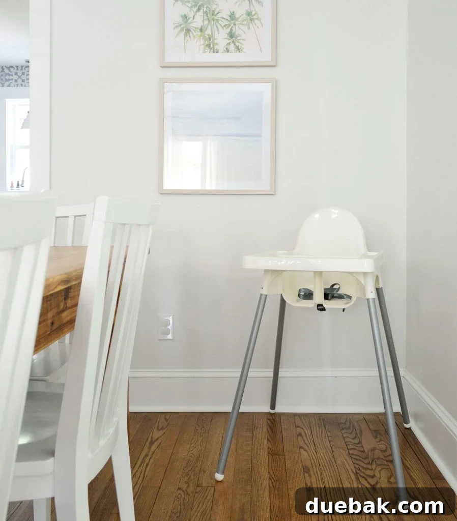 High chair set up in the dining area of the duplex, highlighting family-friendly amenities.