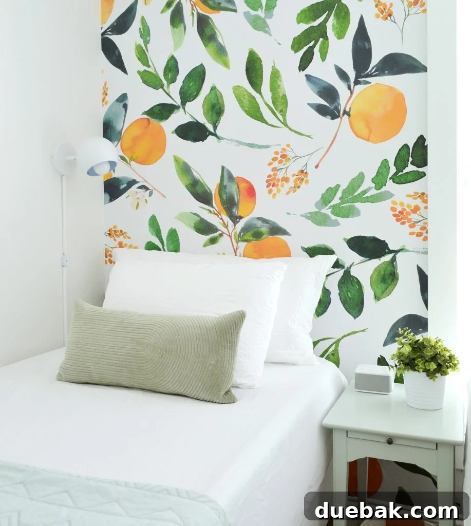 Detail shot of a twin bed with patterned sheets and a nightstand in a bonus sleeping nook.