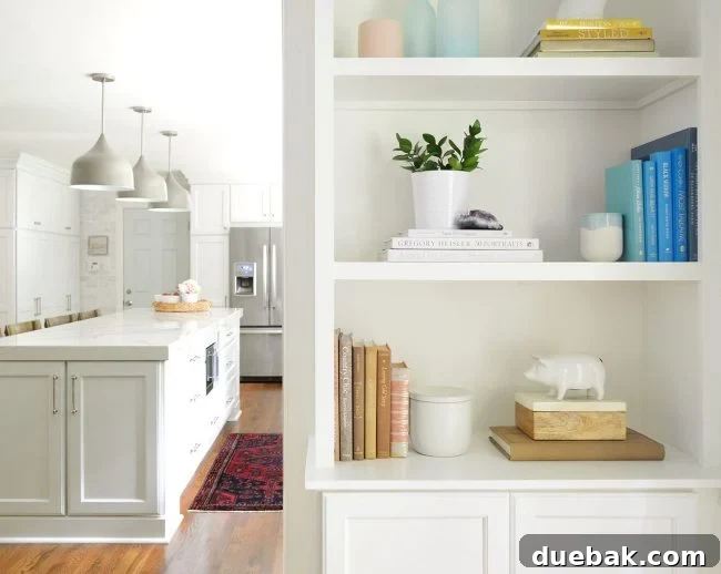 Curated Bookshelf Styling 6 Styled built-in bookshelves with a mix of books, vases, and framed art.