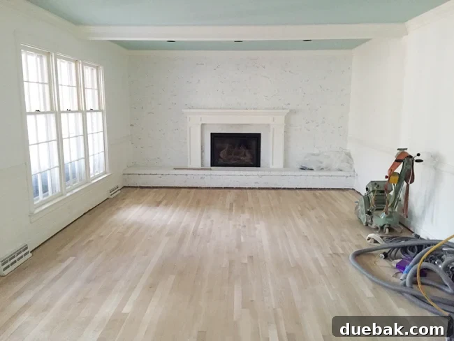 Home Design's White Elephants 8 Living room with furniture moved to one side during hardwood floor refinishing.