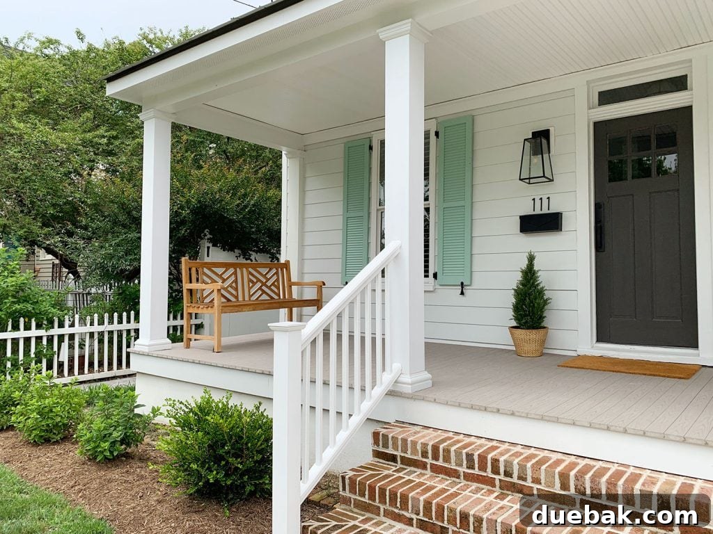 The fully renovated duplex front, showcasing its restored beauty and enhanced curb appeal, a testament to the successful renovation.