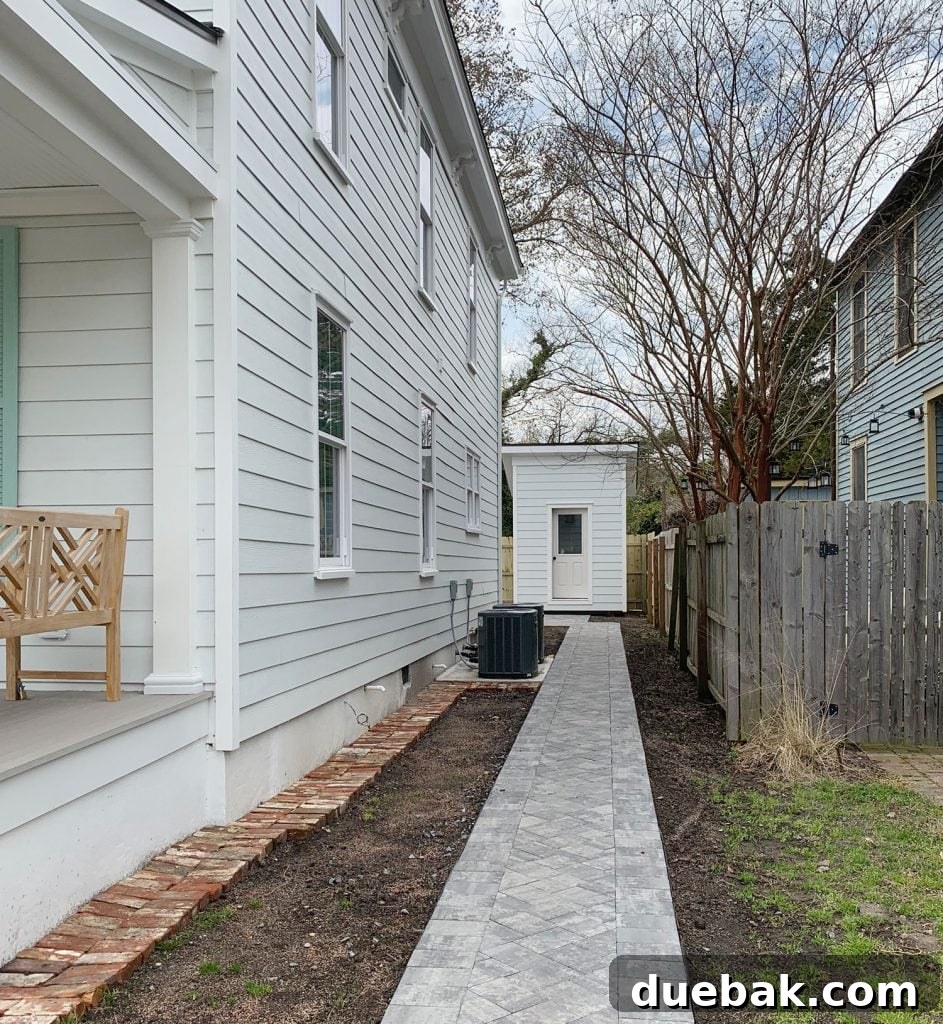 Comparison shot showing the duplex side yard before and after new grass and trees have grown in, emphasizing the positive impact of thoughtful landscaping.
