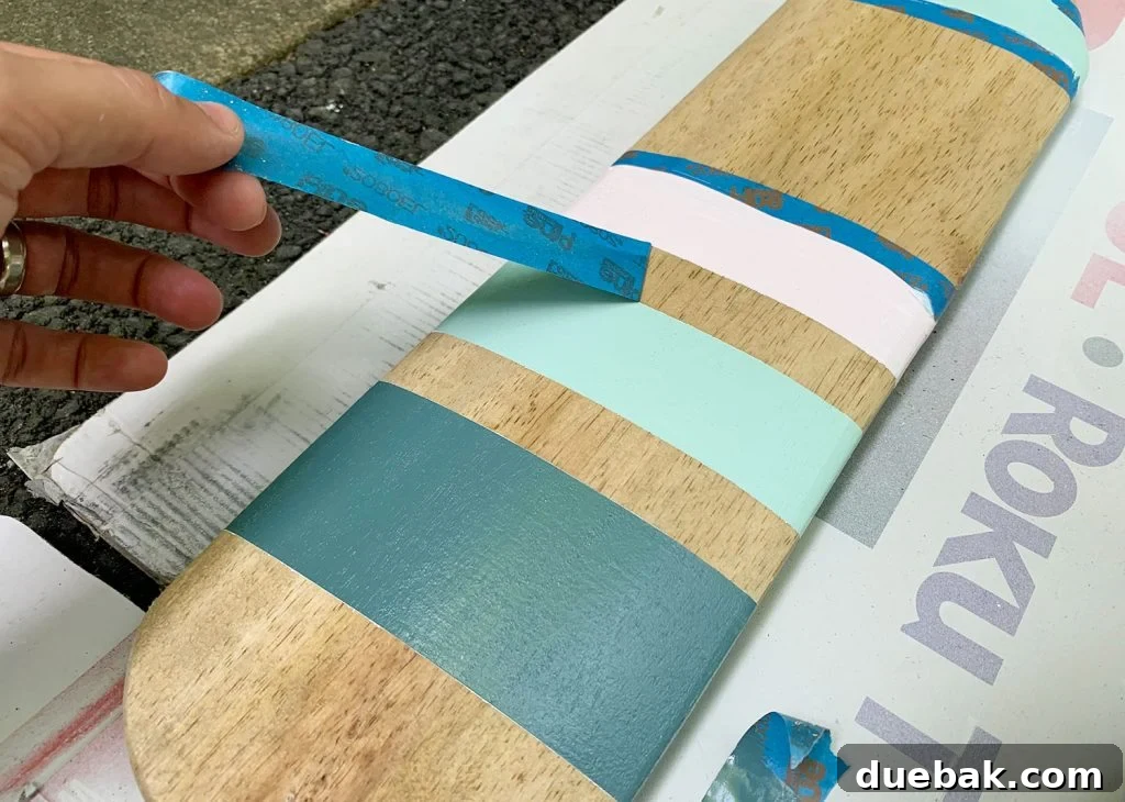 Close-up of freshly painted oar with crisp lines after tape removal
