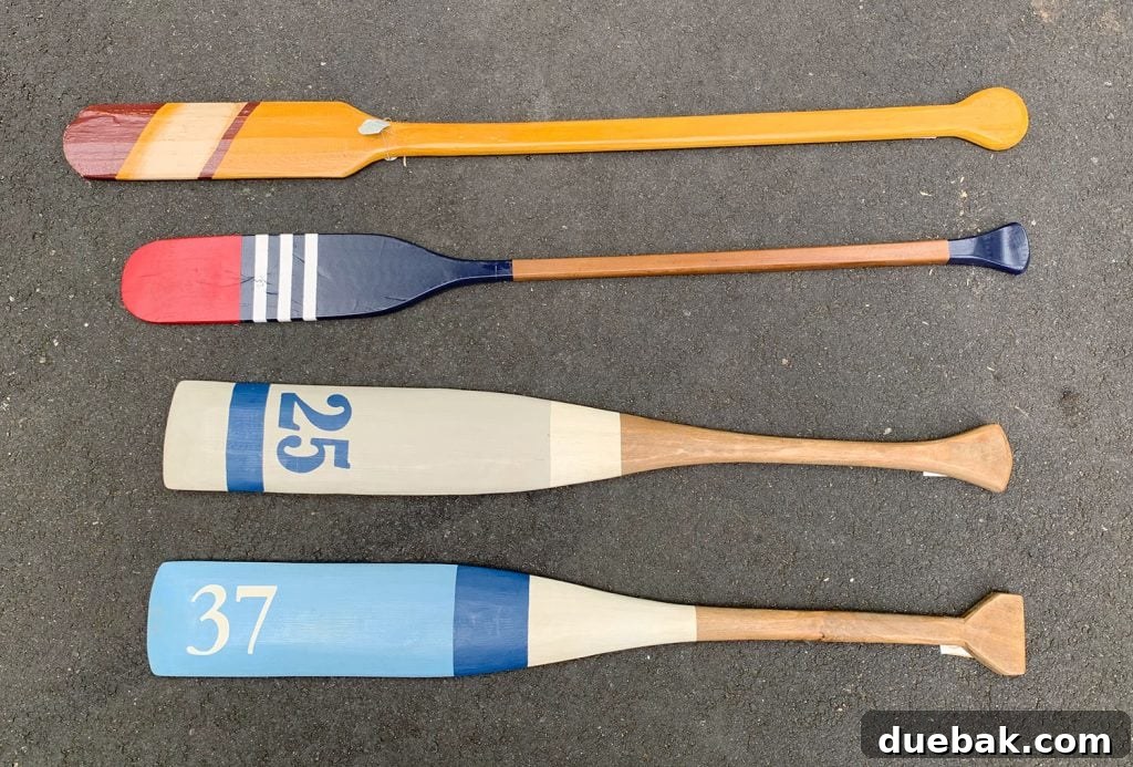 Four mismatched decorative oars before their transformation