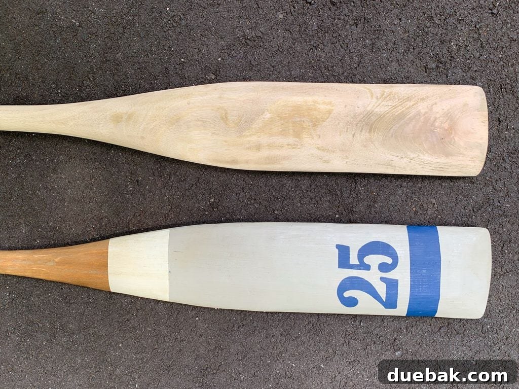 Side-by-side comparison of a sanded and unsanded decorative oar
