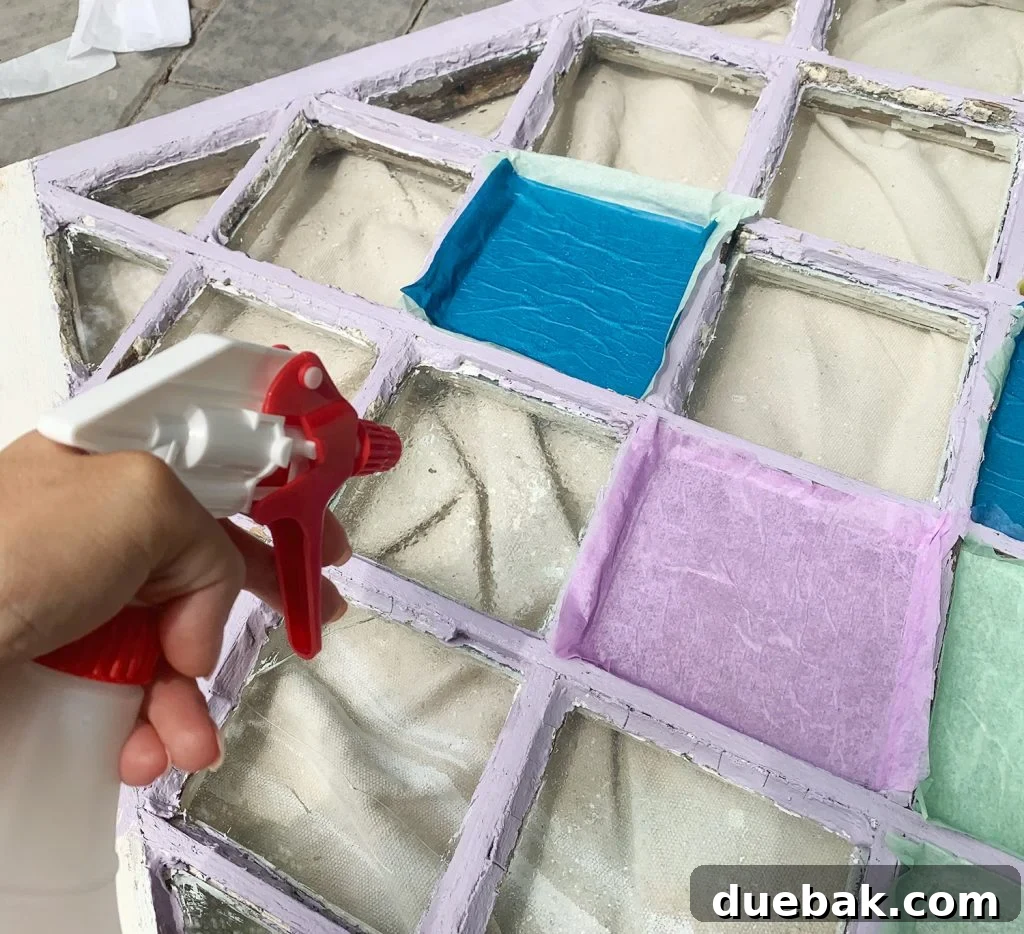 Spraying Diamond Window Pane With Water From Spray Bottle