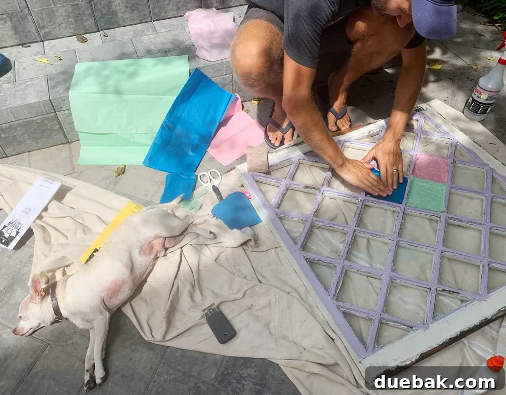 John Testing Tissue Paper Colors On Diamond Glass Window