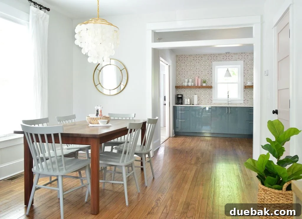 Ikea Kitchen Pricing Deconstructed 13 A bright dining room featuring a stunning capiz chandelier, offering a clear view into the colorful pink and blue duplex kitchen.