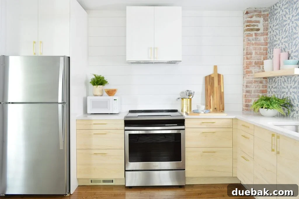 Ikea Kitchen Pricing Deconstructed 16 A crisp white planked wall in the duplex kitchen, adorned with elegant wood open shelves, embodying a clean and inviting design.