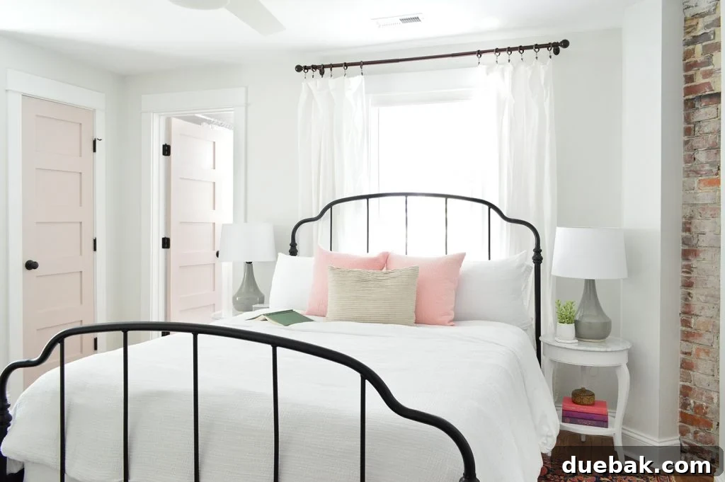 Bedroom with a bed, side table, and lamp